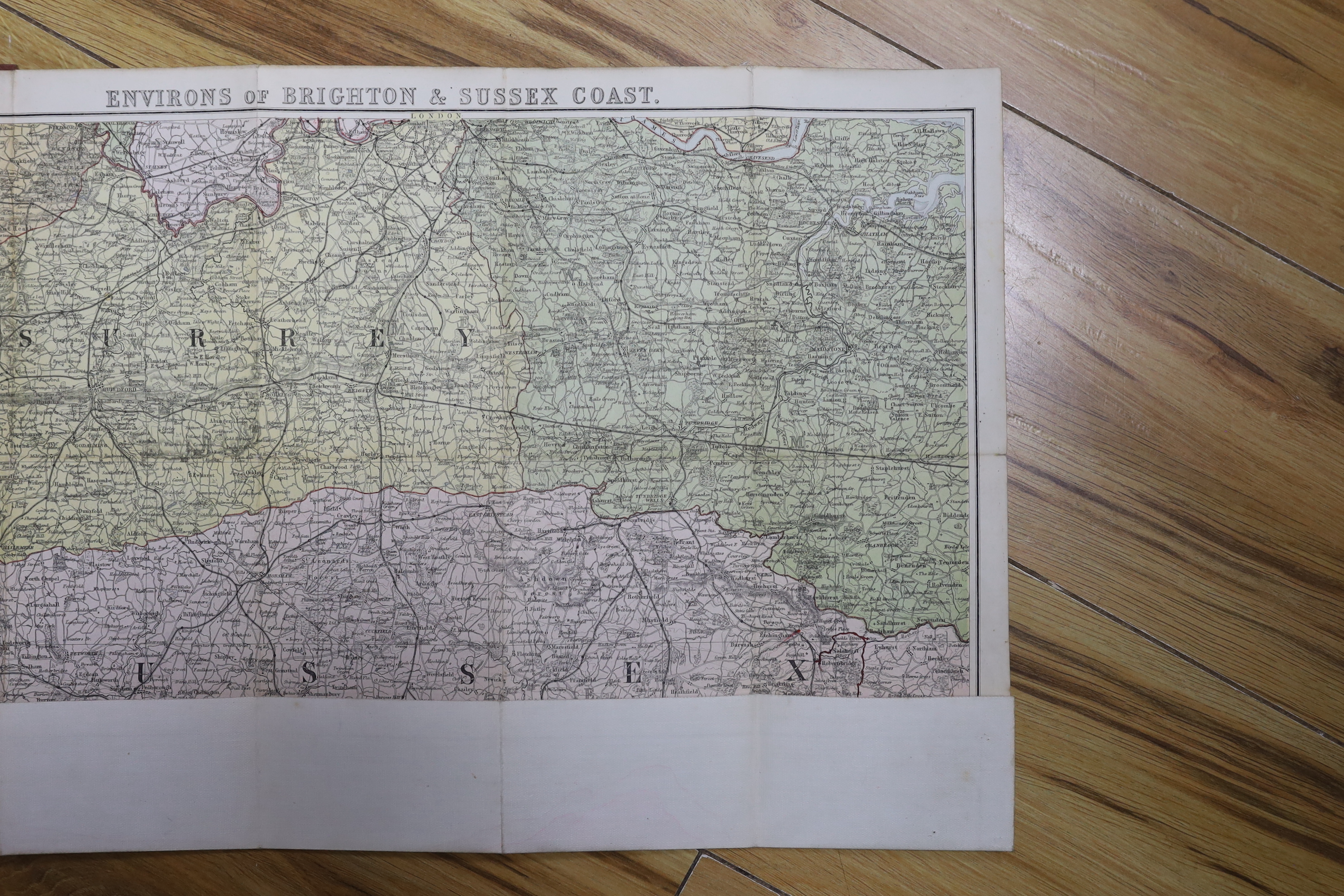 Six 19th and 20th century folding maps of Sussex; an Ordnance Survey (318), a W.H. Smith & Son map, a Smith & Son 172 Strand 1864, two Walker’s County Maps, and a Kelly’s Map